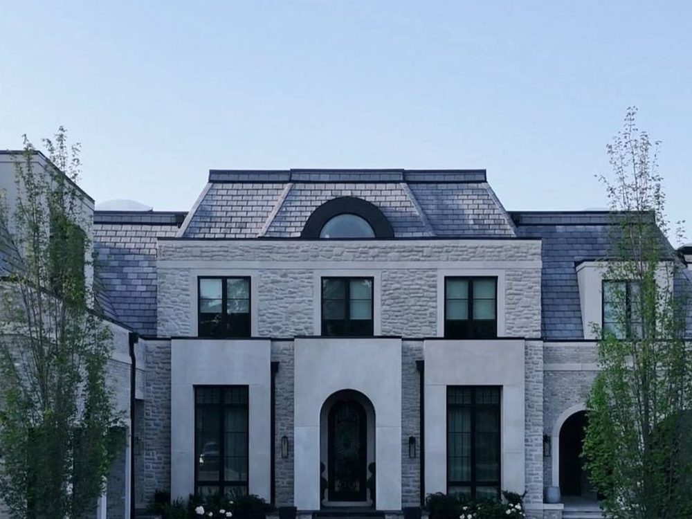 The French Manor on Banner Lane, tumbled limestone with architectural precast and rustic brick