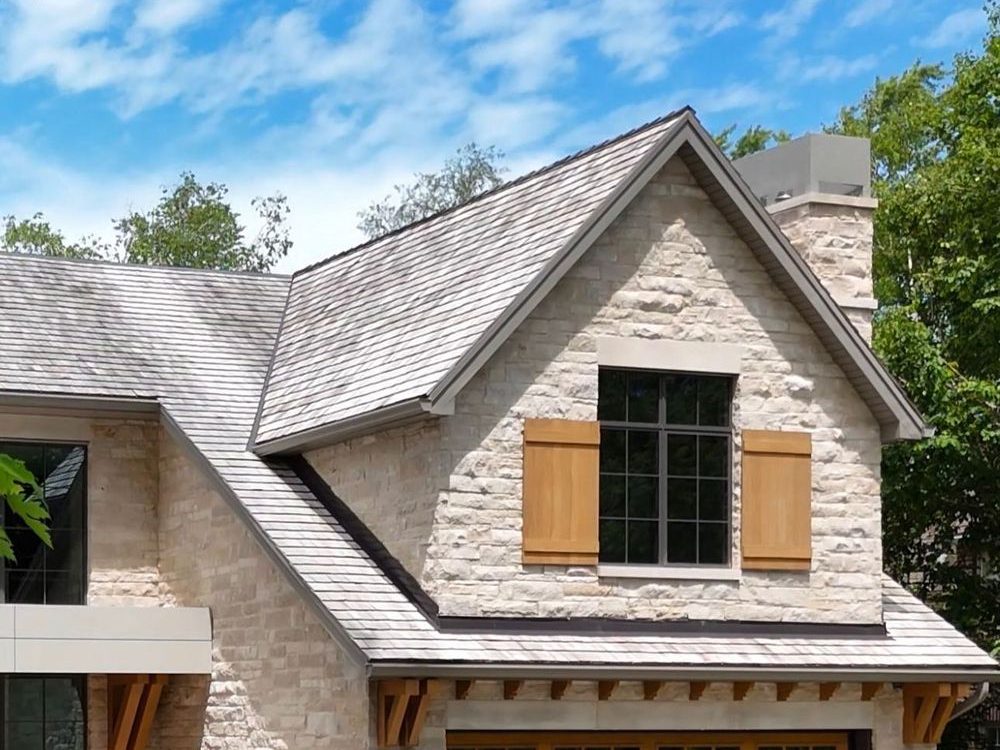 Contemporary English style manor in chiselled natural stone
